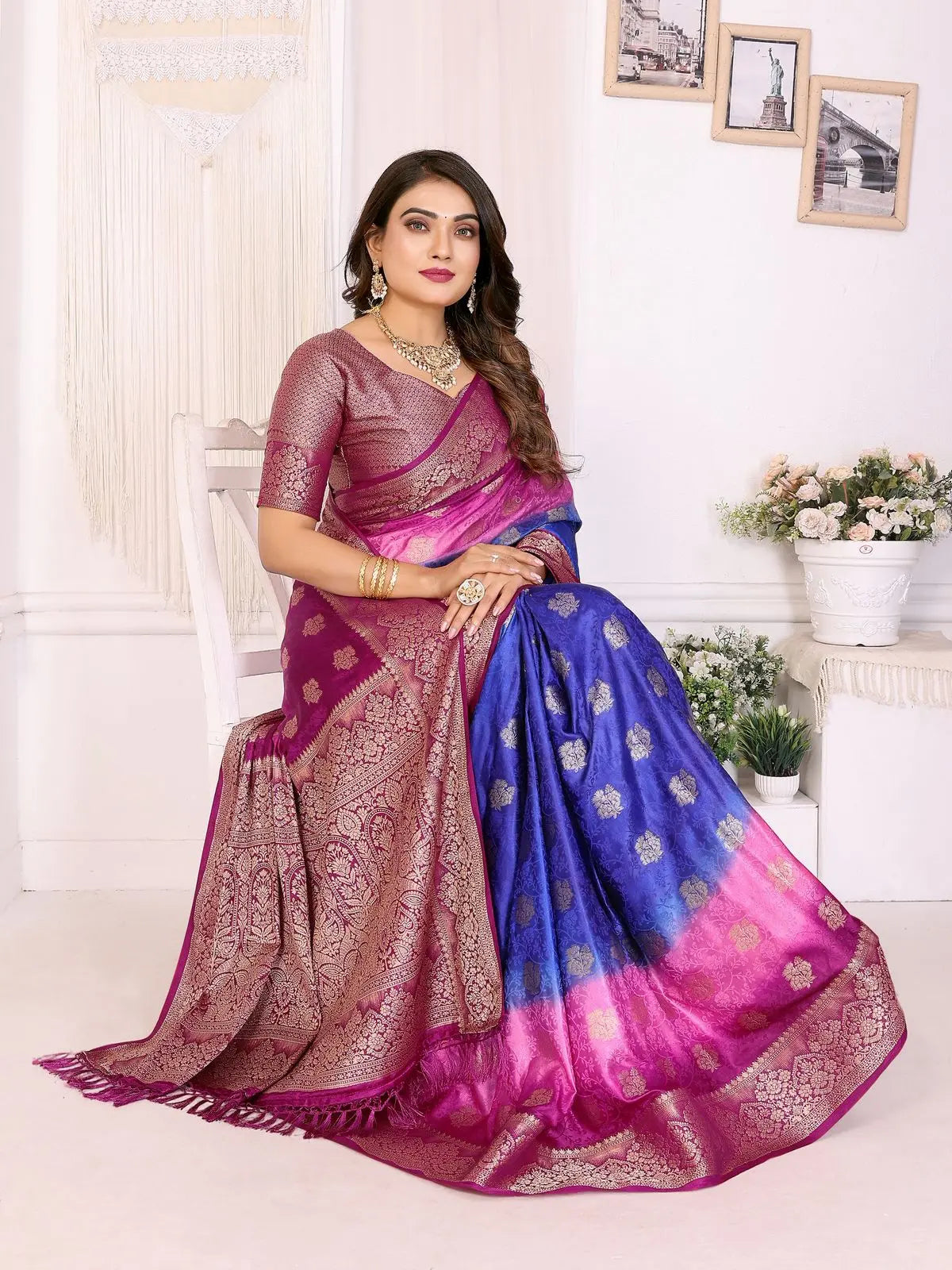 Woman wearing a colorful saree with a white background